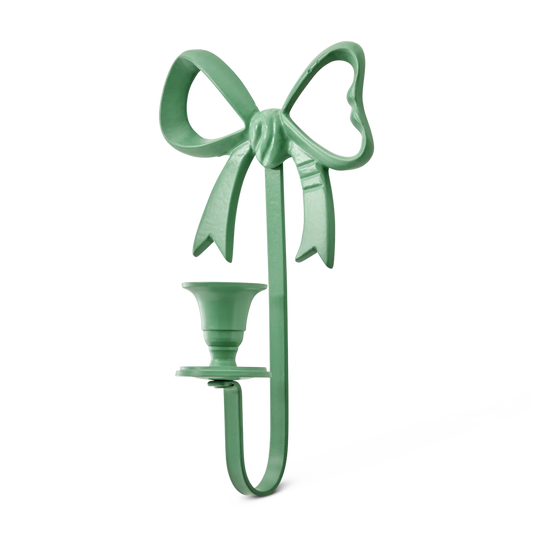 Väggljusstake i metall formad som en rosett i färgen grön.