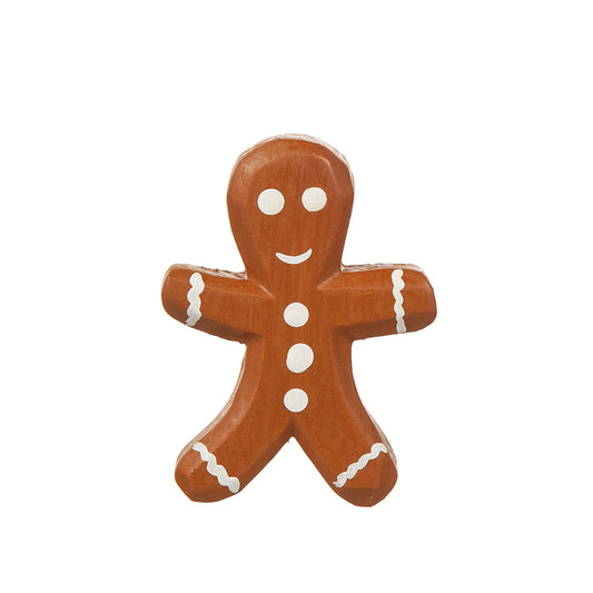 Kylskåpsmagnet i form av pepparkaksgubbe med vit dekor.