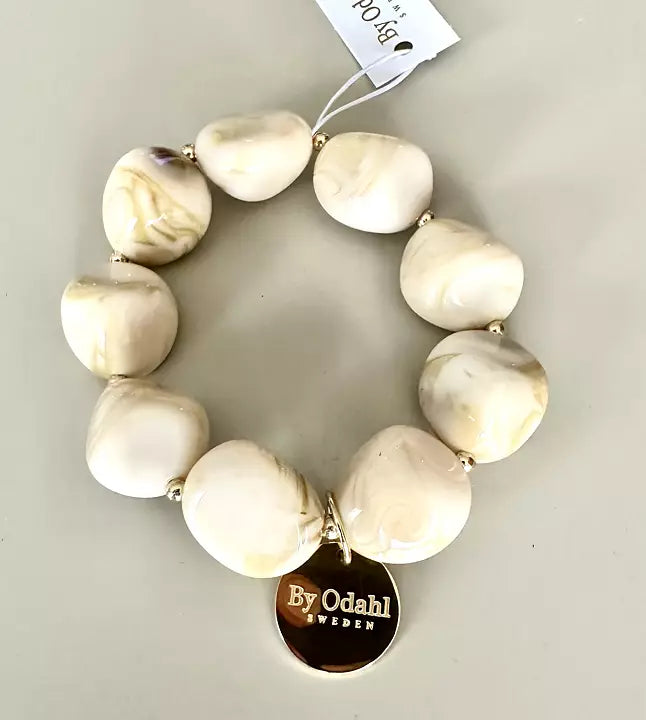 Cremevitt armband marmorerade pärlor